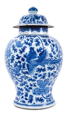 Lot 30 - 18th century Chinese blue and white baluster vase and cover, with phoenix ornament.