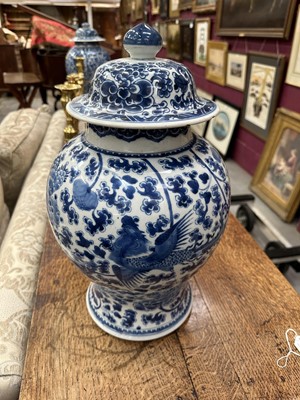 Lot 30 - 18th century Chinese blue and white baluster vase and cover, with phoenix ornament.