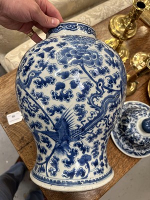 Lot 30 - 18th century Chinese blue and white baluster vase and cover, with phoenix ornament.