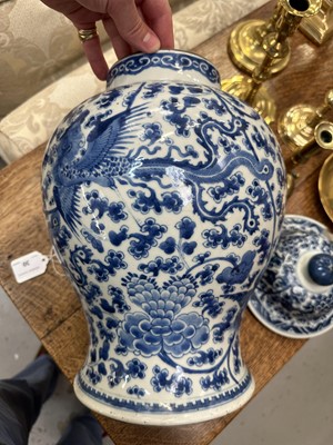 Lot 30 - 18th century Chinese blue and white baluster vase and cover, with phoenix ornament.