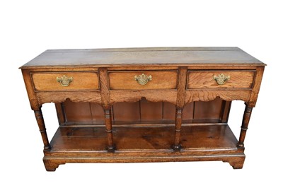 Lot 1217 - George III oak and pine dresser base, with pot shelf below