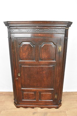 Lot 1185 - George III oak hanging corner cupboard