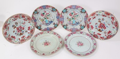 Lot 3 - Six Chinese famille rose export plates, Yongzheng and Qianlong, including two pairs decorated with flowers, and another pair with birds, fruit and flowers in vases, 23cm diameter
