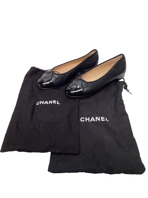 Lot 2079 - Chanel black leather shoes with bow detail and CC logo on patent toe cap with dust bag. Size 36 1/2.  Unworn.