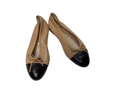 Lot 2082 - Chanel shoes in dark cream leather with CC logo on black patent toe cap with soft dust bags.  Size 36.  Unworn