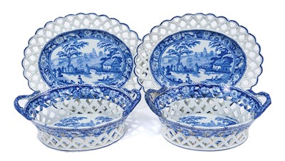 Lot 6 - Pair of 19th century pearlware chestnut baskets and stands, printed in blue and white with landscapes, the stands measuring 27.5cm wide