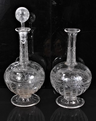 Lot 7 - A pair of late 19th Century Stourbridge clear crystal glass decanters, possibly Thomas Webb & Sons, the body polished intaglio engraved with fish swimming above a scallop shell, 31cm high