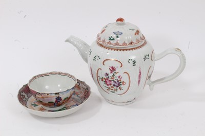 Lot 14 - 18th century Chinese famille rose porcelain teapot, decorated with flowers, together with a tea bowl and saucer decorated in the Mandarin style (3)