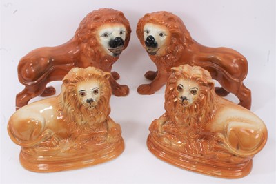 Lot 46 - Two pairs of Victorian Staffordshire pottery lions