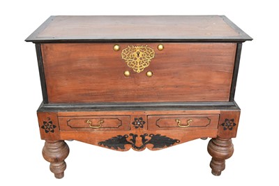 Lot 1102 - 18th century colonial hardwood and ebonised chest on stand, with hinged top and ornate pierced brass lock plate, the base with two drawers on bulbous legs, 103cm wide x 50cm deep x 82cm high