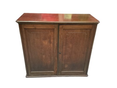 Lot 1187 - Fine quality 19th century Colonial padouk or hardwood cabinet, with shelves enclosed by pair of panel doors, with T Parsons, Patented lock, flanked by flush brass carrying handles, 96cm wide x 40cm...