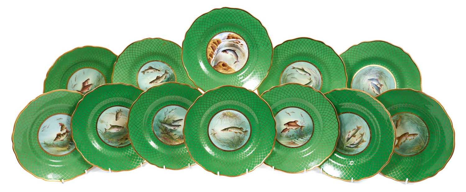 Lot 18 - Set of twelve early 20th century Spode plates decorated with fish, titled verso, on a green and gilt fish-scale ground, stamped marks, 23cm diameter