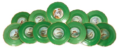 Lot 18 - Set of twelve early 20th century Spode plates decorated with fish, titled verso, on a green and gilt fish-scale ground, stamped marks, 23cm diameter
