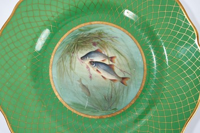 Lot 18 - Set of twelve early 20th century Spode plates decorated with fish, titled verso, on a green and gilt fish-scale ground, stamped marks, 23cm diameter