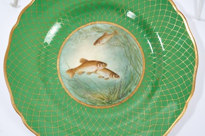 Lot 18 - Set of twelve early 20th century Spode plates decorated with fish, titled verso, on a green and gilt fish-scale ground, stamped marks, 23cm diameter