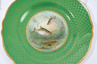 Lot 18 - Set of twelve early 20th century Spode plates decorated with fish, titled verso, on a green and gilt fish-scale ground, stamped marks, 23cm diameter