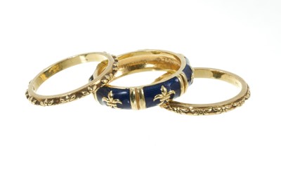 Lot 354 - 18ct gold and enamel stacking rings by Hidalgo, the central band with fleur-de-lys design, signed. Ring size M.
