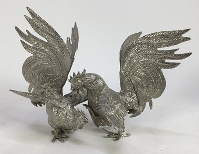 Lot 784 - Pair of silver plated fighting cocks with outspread wings and tail feathers