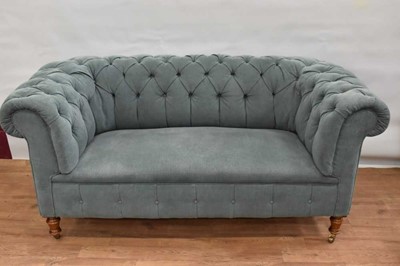 Lot 1148 - Victorian teal coloured button upholstered chesterfield sofa, raised on turned legs and castors, approximately 175cm long