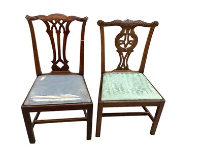 Lot 1141 - Two George III carved mahogany Chippendale period side chairs with pierced gothic vase shape splat backs on square chamfered legs.