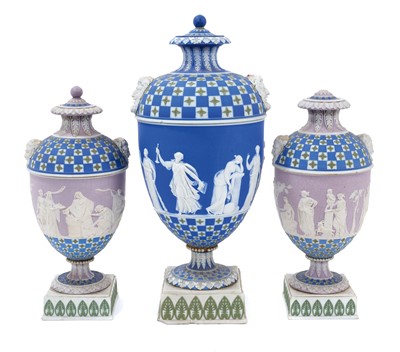Lot 92 - Rare garniture of three 19th century Wedgwood jasper ware vases