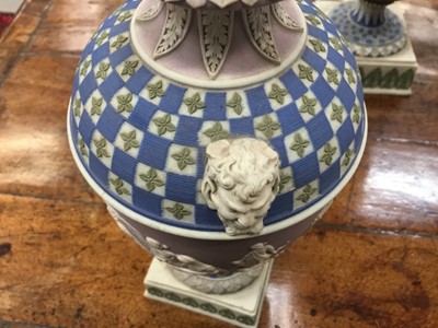 Lot 92 - Rare garniture of three 19th century Wedgwood jasper ware vases
