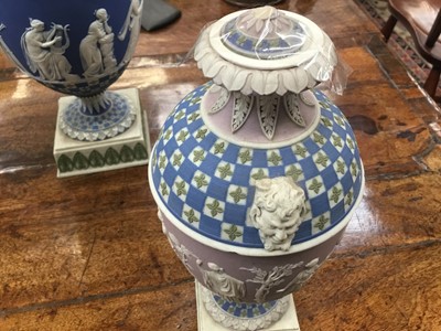 Lot 92 - Rare garniture of three 19th century Wedgwood jasper ware vases