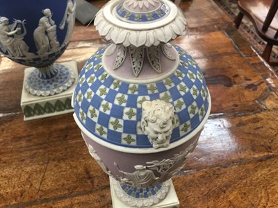 Lot 92 - Rare garniture of three 19th century Wedgwood jasper ware vases