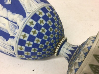 Lot 92 - Rare garniture of three 19th century Wedgwood jasper ware vases