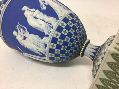Lot 92 - Rare garniture of three 19th century Wedgwood jasper ware vases