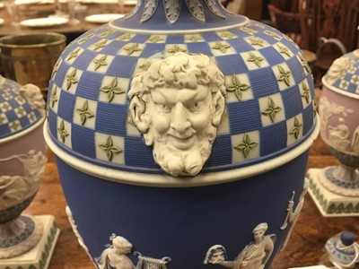 Lot 92 - Rare garniture of three 19th century Wedgwood jasper ware vases