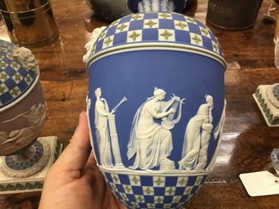 Lot 92 - Rare garniture of three 19th century Wedgwood jasper ware vases