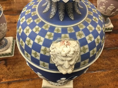 Lot 92 - Rare garniture of three 19th century Wedgwood jasper ware vases