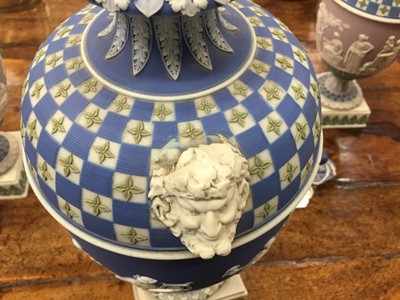 Lot 92 - Rare garniture of three 19th century Wedgwood jasper ware vases