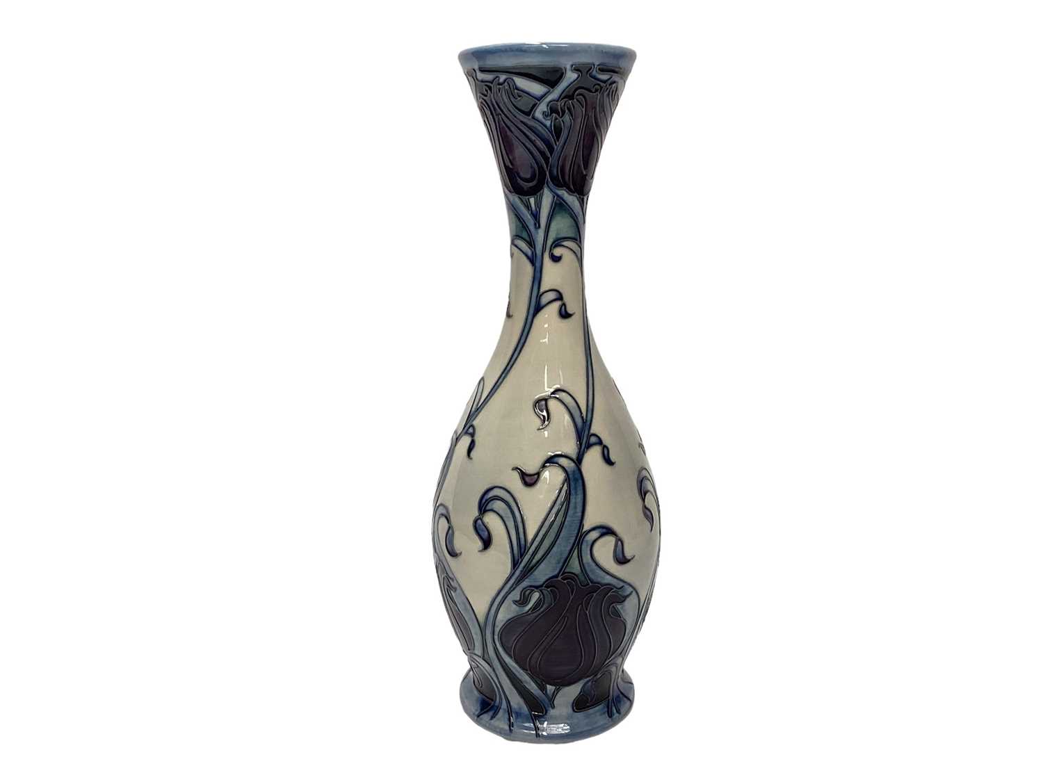Lot 1146 - Moorcroft pottery vase decorated with blue and purple flowers on cream ground, signed Emma Bossons, numbered 3 of 4, dated 14.11.09, 36.5cm high, boxed