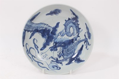 Lot 3 - 18th century Chinese blue and white porcelain plate, decorated with a dragon chasing a flaming pearl, seal mark to base