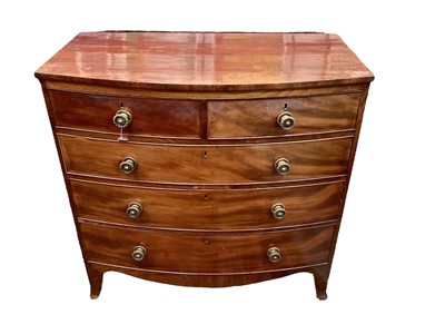 Lot 1233 - Regency mahogany bow front chest of two short and three long graduated drawers
