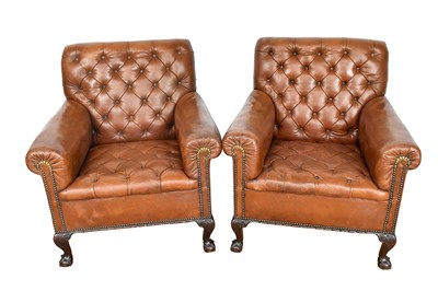 Lot 1107 - Pair of early 20th century leather upholstered club chairs, raised on carved cabriole legs and claw and ball feet