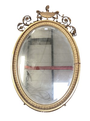 Lot 1145 - 19th century Classical revival  gilt gesso wall mirror with scrolling crest