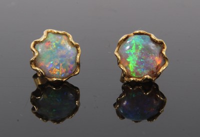 Lot 515 - Pair of opal stud earrings with a circular opal cabochon in gold setting with post and butterfly fittings, 9-9.5mm.