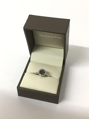 Lot 32 - White and black diamond cluster ring with a central cluster of black diamonds surrounded by a border of white diamonds, in 9ct white gold, estimated total diamond weight approximately 0.25cts. Purc...