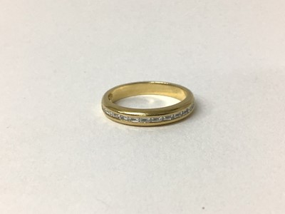 Lot 78 - Diamond eternity ring with a half hoop of fourteen baguette cut diamonds weighing a total of 0.34cts, channel set into a half round shank.