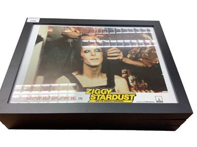 Lot 2200 - David Bowie in Ziggy Stardust and the Spiders from Mars, collection of lobby cards including three framed, with certificate of authenticity