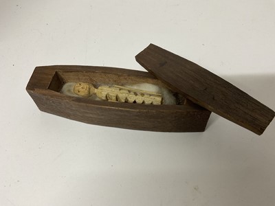 Lot 41 - Rare hand carved softwood poppet, the whittled figure of skeletal appearance, housed with a carved mahogany miniature coffin, 19th century or earlier