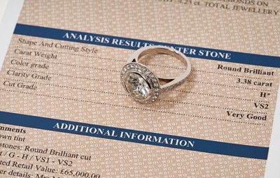 Lot 692 - Fine diamond single stone ring, the round brilliant cut diamond weighing 3.38 carats, in a rub-over setting, surrounded by a border of twenty-five brilliant cut diamonds with fourteen diamonds to t...