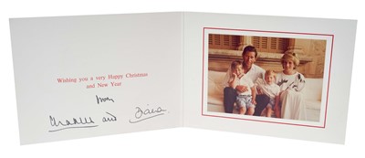 Lot 173 - T.R.H. The Prince and Princess of Wales, signed 1986 Christmas card with twin gilt ciphers to cover, colour photograph of the relaxed Royal couple with their young sons on holiday in Spain, signed...