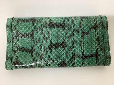 Lot 2072 - Gucci green python skin clutch purse with soft bag.