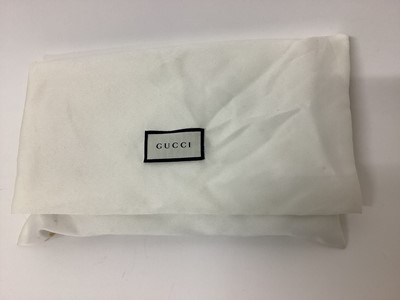 Lot 2072 - Gucci green python skin clutch purse with soft bag.