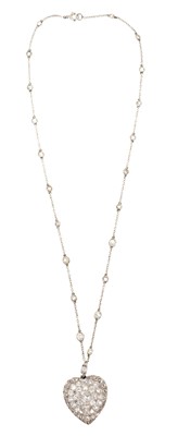 Lot 667 - Antique diamond heart shape pendant necklace, the large heart shape pendant with pavé-set old cut and rose cut diamonds, the reverse enclose by a glazed locket compartment, suspended from a diamond...