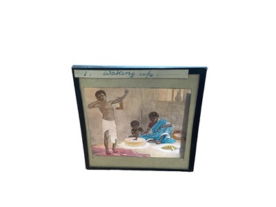 Lot 2414 - Collection of magic lantern slides in an unusually long mahogany case